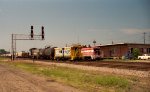 CSX 1186 pushes a train north, past the signals at Charlie Baker and NCYR train